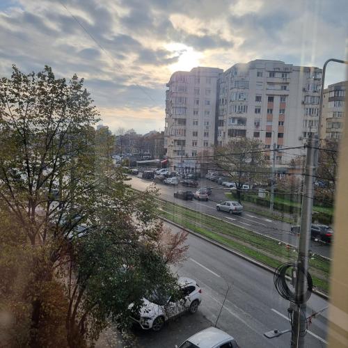 a view of a city street with cars and buildings at Ploiesti Central Apartament in Ploieşti