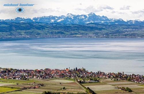 a large group of people standing around a body of water at Spatzennest am Bodensee in Bermatingen