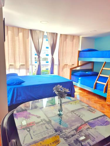 Voodi või voodid majutusasutuse Apartaestudios coral del rodadero - cerca al mar toas