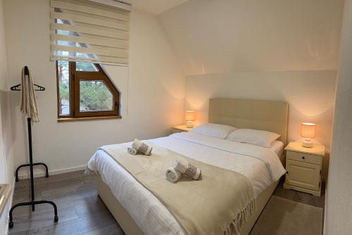 Ένα ή περισσότερα κρεβάτια σε δωμάτιο στο WoodAvenue