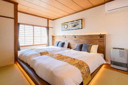 Ένα ή περισσότερα κρεβάτια σε δωμάτιο στο 函館大手町高田屋