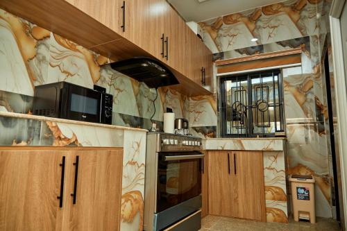 Η κουζίνα ή μικρή κουζίνα στο The Nook Apartments