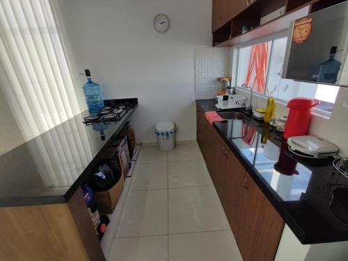 a small kitchen with a counter and a sink at Arena cielo y Mar in Naranjalito