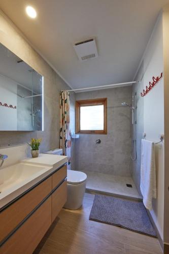 a bathroom with a sink and a toilet and a shower at Forest Romance Retreat near Doncaster Westfield M3 in Doncaster