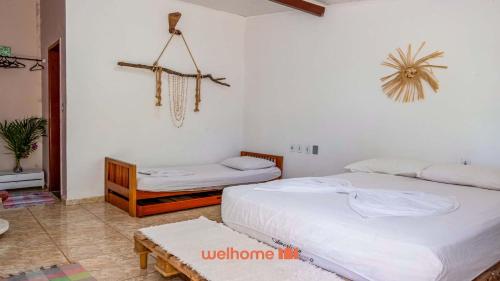 Ένα ή περισσότερα κρεβάτια σε δωμάτιο στο Pouso da Pardoca