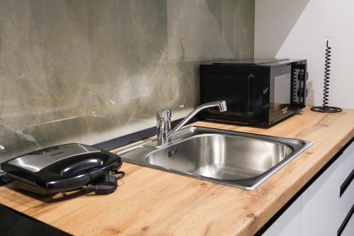 Kuchyň nebo kuchyňský kout v ubytování HORIZONT Central Stay Apart-Hotel