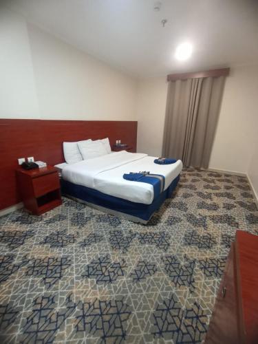 Postel nebo postele na pokoji v ubytování zad alqema hotel
