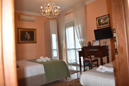 Ένα ή περισσότερα κρεβάτια σε δωμάτιο στο B&K Hotels