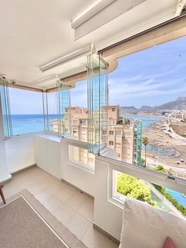 an apartment with a view of the ocean at Casa Estío - Renovated 1st line sea view apartment, pool access, AC - Calpe Costa Blanca in Ifach