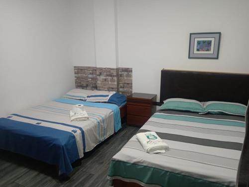 Rúm í herbergi á Hotel RUAH