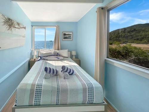 Ένα ή περισσότερα κρεβάτια σε δωμάτιο στο Blue on Cockle