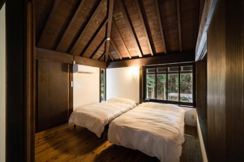 En eller flere senge i et værelse på COCO VILLA 伊豆赤沢-Izu Akazawa-