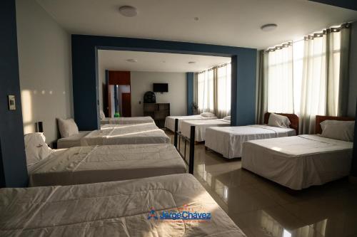 Cama o camas de una habitación en Hotel JORGE CHAVEZ