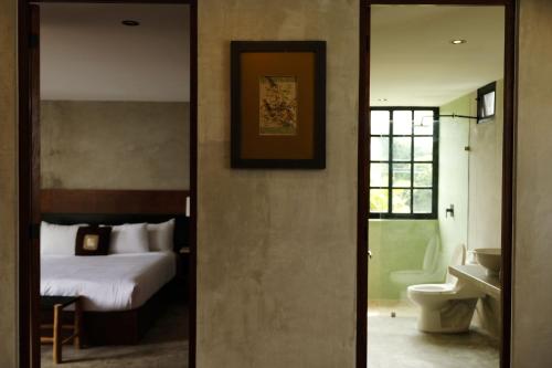 Ένα ή περισσότερα κρεβάτια σε δωμάτιο στο Turquoise Tulum Hotel