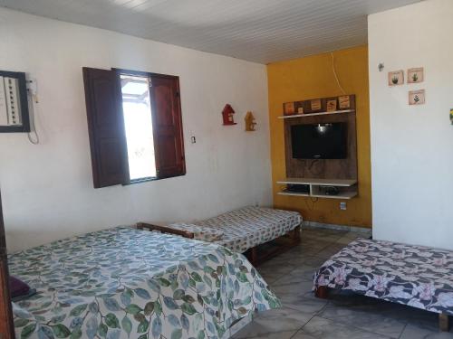 Postel nebo postele na pokoji v ubytování Casa Cantinho do Céu Santo Amaro MA