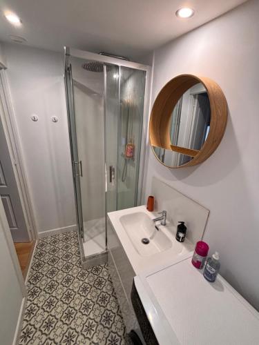 a white bathroom with a shower and a sink at Superbe T3 lumineux à louer à Bidart, proche océan et centre ville in Bidart