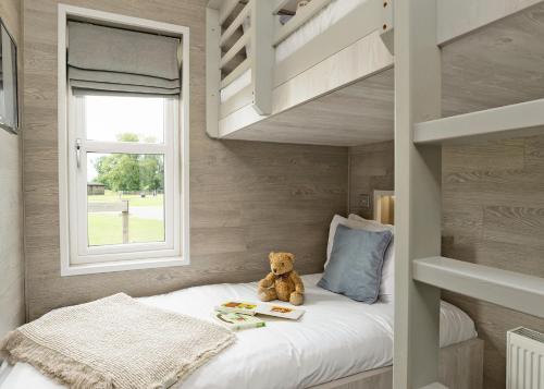 Ένα ή περισσότερα κρεβάτια σε δωμάτιο στο Aspen Lodge Escape