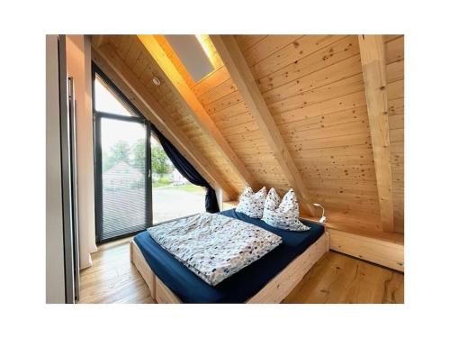 Postel nebo postele na pokoji v ubytování Käthe Am Wariner See