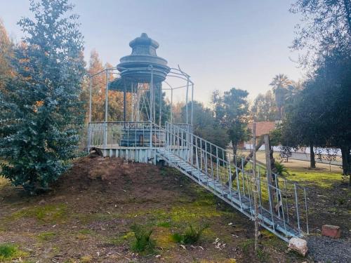 a gazebo with a tower in a park at Hacienda Ranguil in Lolol