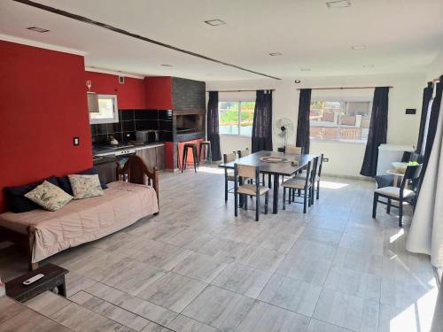 a living room with a couch and a table at Departamento Temporal en Villa Carlos Paz in Villa Carlos Paz