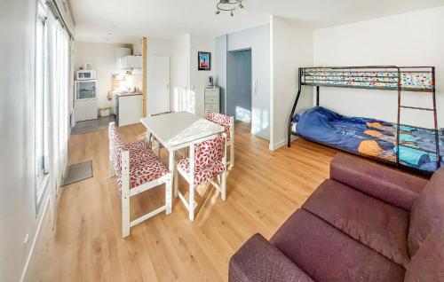 a living room with a couch and a bunk bed at Cozy Apartment In Dunkerque in Dunkerque