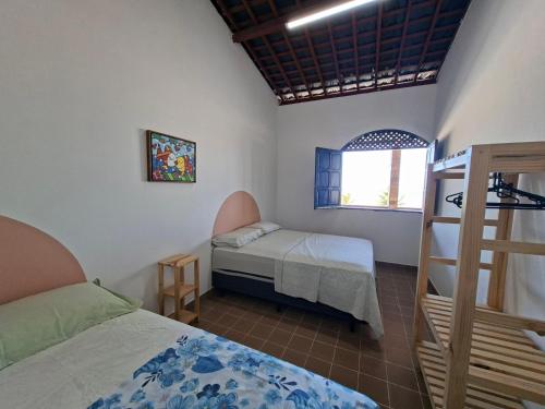 Postel nebo postele na pokoji v ubytování Casa da Janelas Azuis Praia Azul