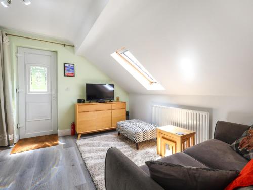 TV a/nebo společenská místnost v ubytování Four Oaks