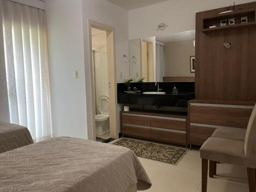 Ένα ή περισσότερα κρεβάτια σε δωμάτιο στο Refúgio Escarpas do Lago Mirante 1702