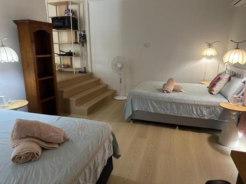 Ένα ή περισσότερα κρεβάτια σε δωμάτιο στο Granadilla ST 超大独立附属公寓G4