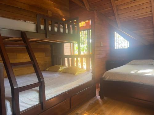 Ένα ή περισσότερα κρεβάτια σε δωμάτιο στο Casa Carao Peninsula de Nicoya - front beach