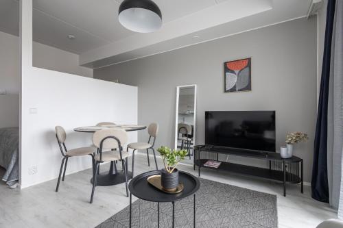 TV a/nebo společenská místnost v ubytování Pramea Apartments Asematalo