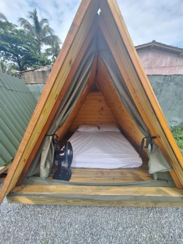 Ένα ή περισσότερα κρεβάτια σε δωμάτιο στο Cabanas Beach Maresias