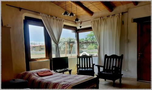 En eller flere senge i et værelse på CabañaPerchel Tilcara Quebrada de Humahuaca