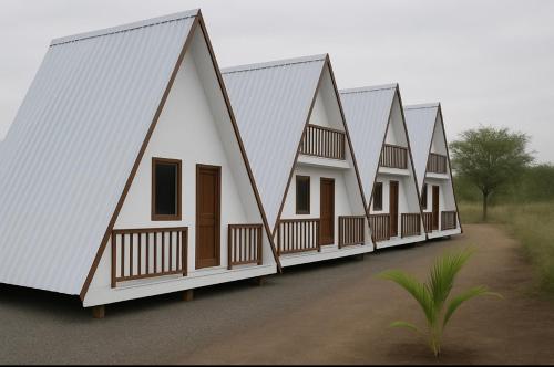 マナグアにあるCielos D Amoreの一列に並んだ同じ家