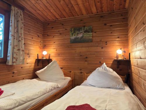 Ένα ή περισσότερα κρεβάτια σε δωμάτιο στο Ferienhaus mit Terrasse