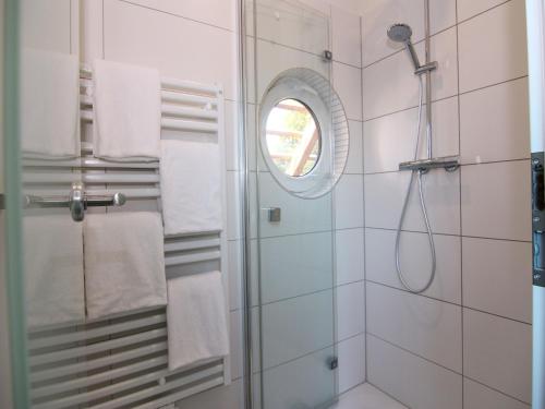 a bathroom with a shower and a window at Chalet mit Außensauna in Wendorf in Wendorf