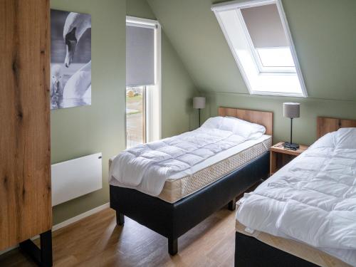 Ένα ή περισσότερα κρεβάτια σε δωμάτιο στο Garden Paradise in Frisian