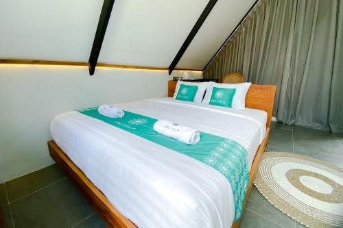 Postel nebo postele na pokoji v ubytování Ubu Villa Coconut 103 - in Yogyakarta