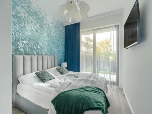 Ένα ή περισσότερα κρεβάτια σε δωμάτιο στο Apartment in Niechorze by Baltic Beach