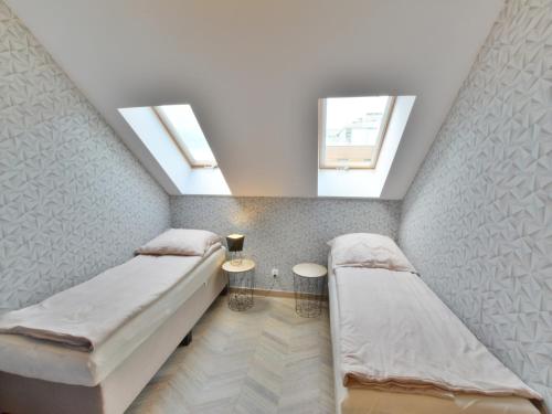 Ένα ή περισσότερα κρεβάτια σε δωμάτιο στο Apartment in Ustronie Morskie by the Beach