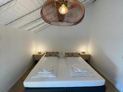 Ένα ή περισσότερα κρεβάτια σε δωμάτιο στο Cozy Voerendaal Getaway for 4