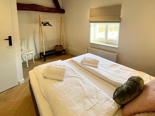 Ένα ή περισσότερα κρεβάτια σε δωμάτιο στο Holiday home in Voerendaal with garden