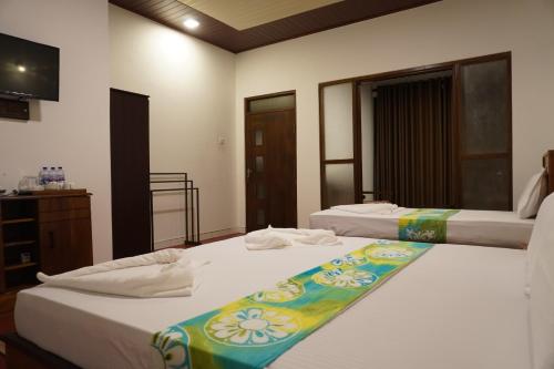 Кровать или кровати в номере Green Earth Resort