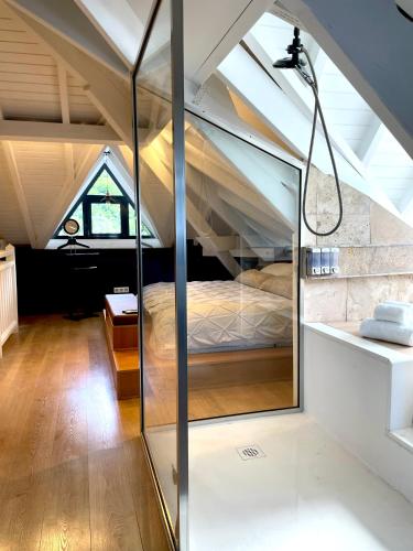 a room with a bed in a attic at Caribbean Loft - SXM in Anse Marcel 