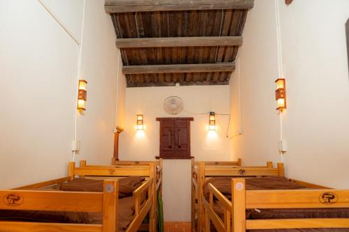 a church with three beds in a room at Beishan Old Western Style Hostel in Jinning