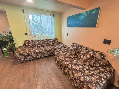 Televiisor ja/või meelelahutuskeskus majutusasutuses SiempreViva Hospedaje By GEstores