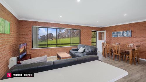 Khu vực ghế ngồi tại Cuttagee Beach Cottages, 6