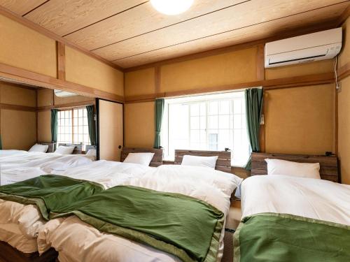 Ένα ή περισσότερα κρεβάτια σε δωμάτιο στο Ocean villa Oarai - Vacation STAY 94315v