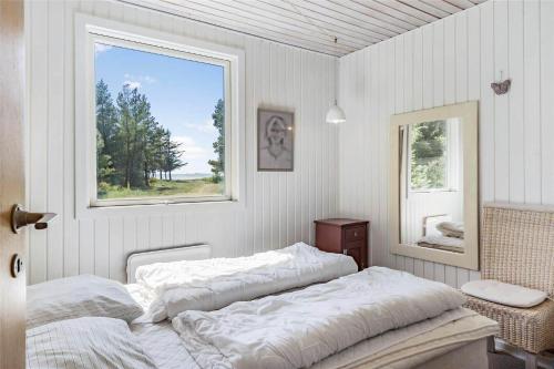 Ένα ή περισσότερα κρεβάτια σε δωμάτιο στο LF10236-Thyholm-Svinget-18