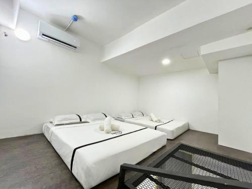 Ένα ή περισσότερα κρεβάτια σε δωμάτιο στο Seeds Hotel Premier Chow Kit Kuala Lumpur